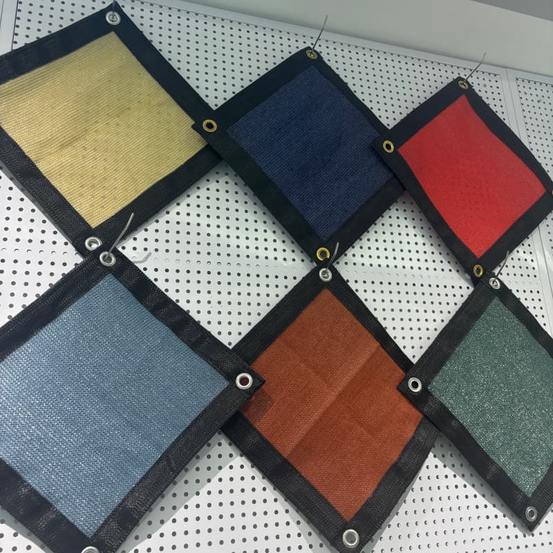 Lona de malla de HDPE duradera con ojales para sombra.